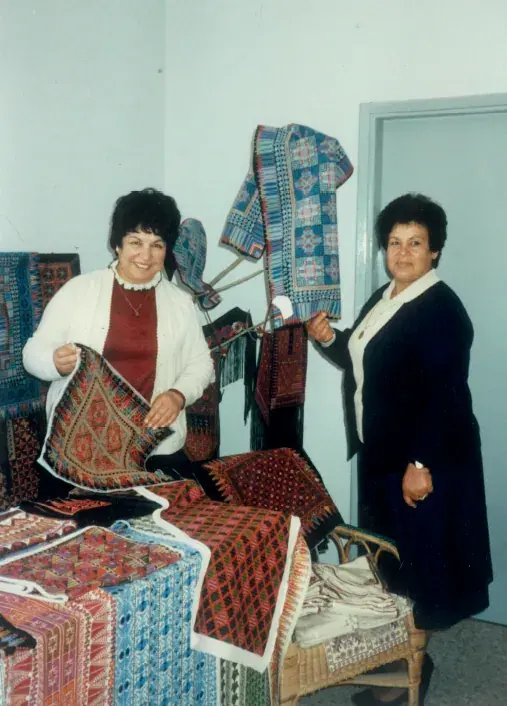 The founders with embroidered textiles